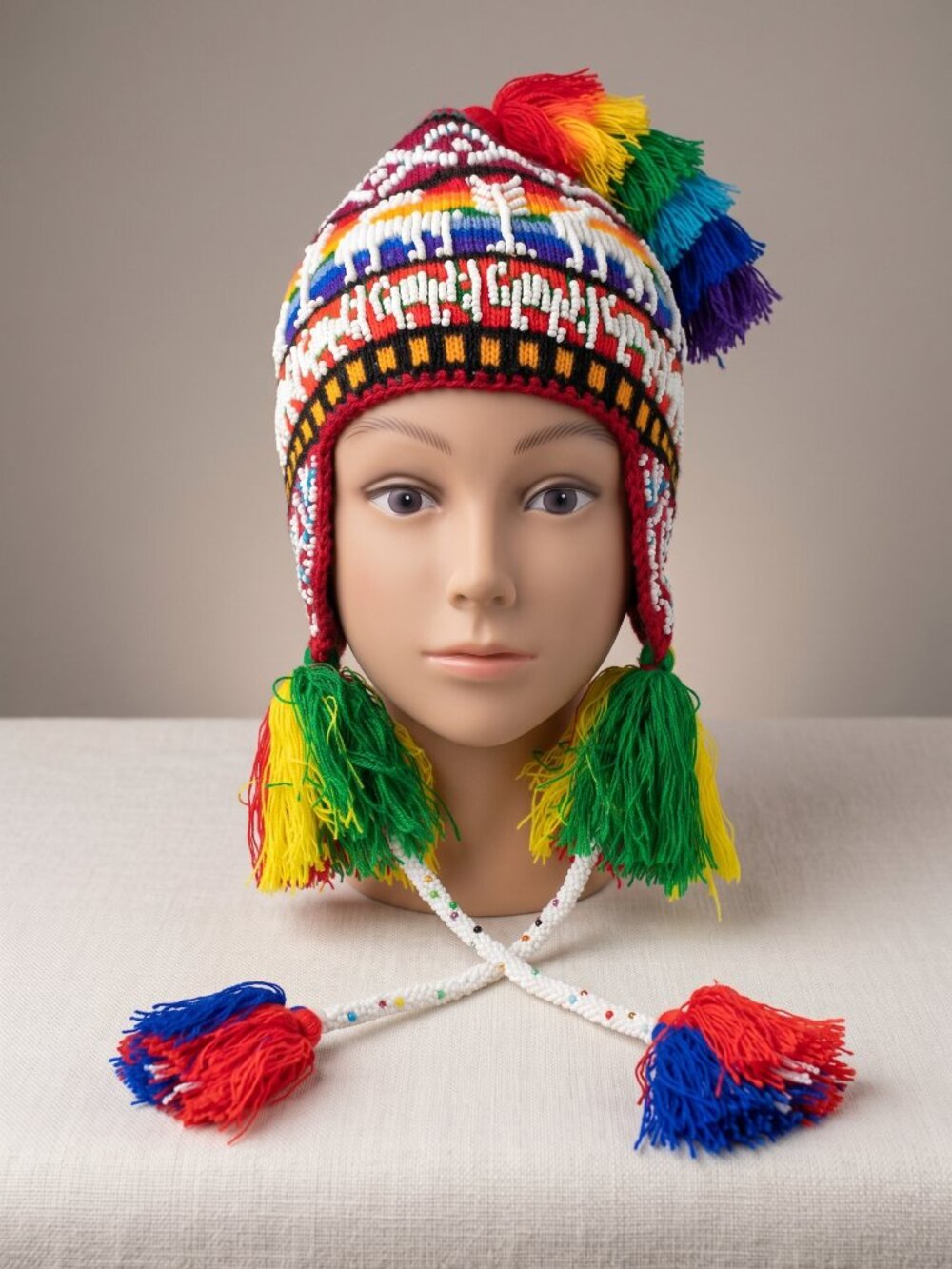 Andean Knitted Wool Chullo with Seed Beads and Multicolored Pom-poms